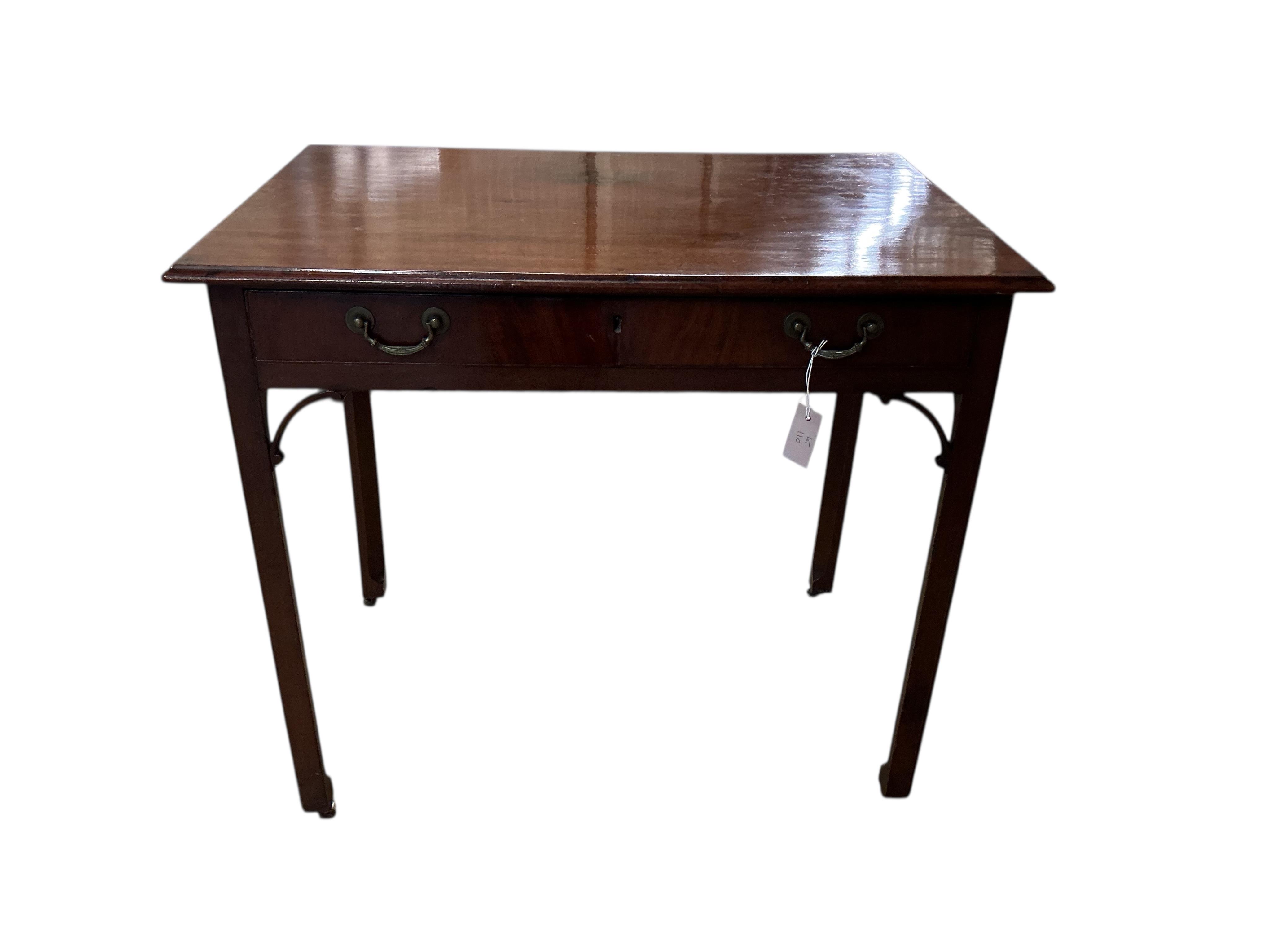 A George III mahogany serving table on chamfered square legs, width 91cm, depth 61cm, height 79cm.